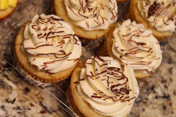 Vanilla cupcakes with vanilla Buttercream and a chocolate drizzle!