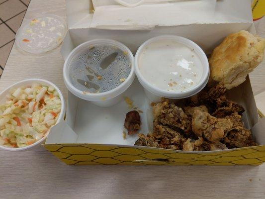 Combo pack of chicken gizzards and livers, coleslaw, green beans, biscuit, and gravy.