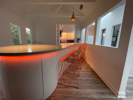 Curved Island with lights and wine fridge