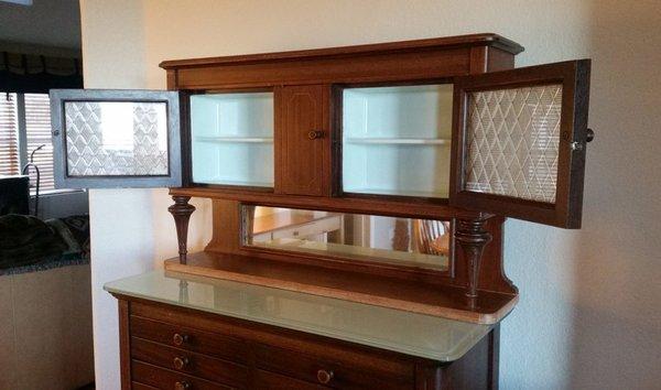 Glass inserts in antique dental cabinet