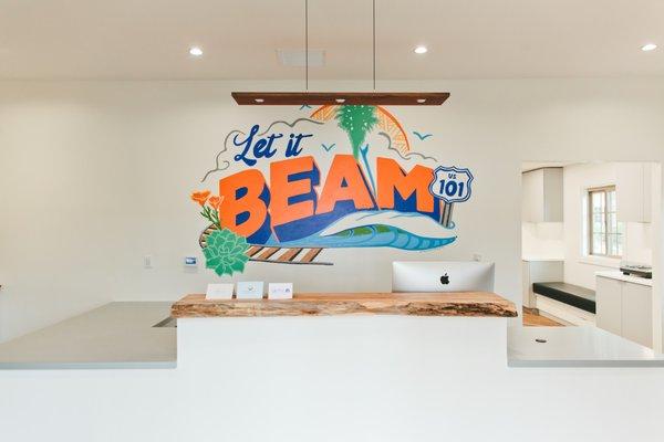 Our front desk mural painted by local muralist Skye Walker!