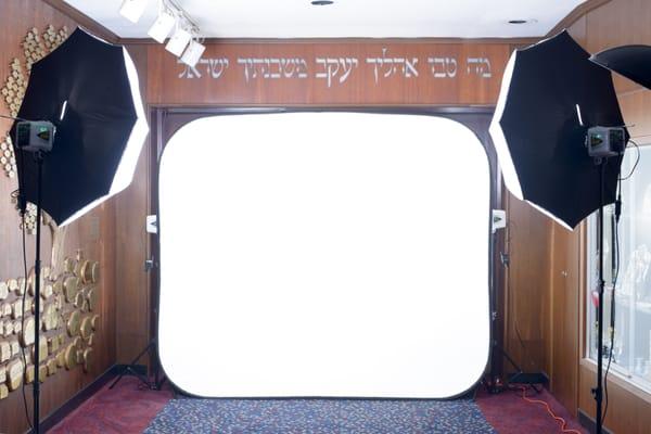 This is a photo of our professional photo booth set up: pure-white backdrop and professional photo lights.