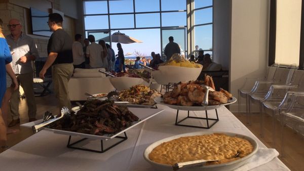 Buffet table at a beach house event.