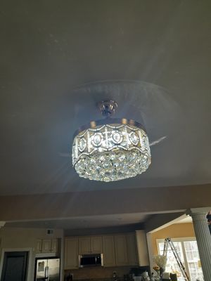 Chandelier with a fan