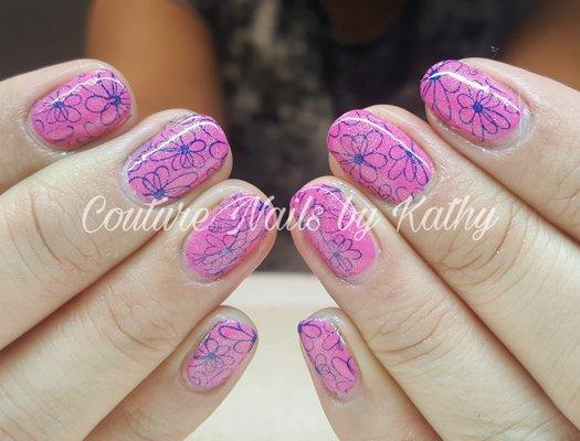 Shellac manicure with a floral stamped design.