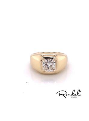 Radiant cut engagement ring set in wide yellow gold band