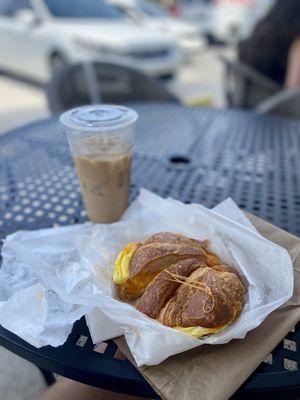 Large iced vanilla latte & croissant egg/cheese sandwich