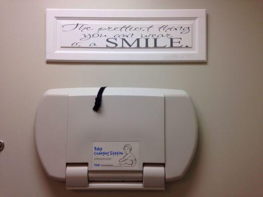 Sign on the wall in the bathroom: "A smile is the prettiest thing you can wear!"  And there's a handy changing table!