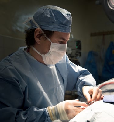 Dr. Egan performing surgery in Bolivia as part of a medical relief trip.