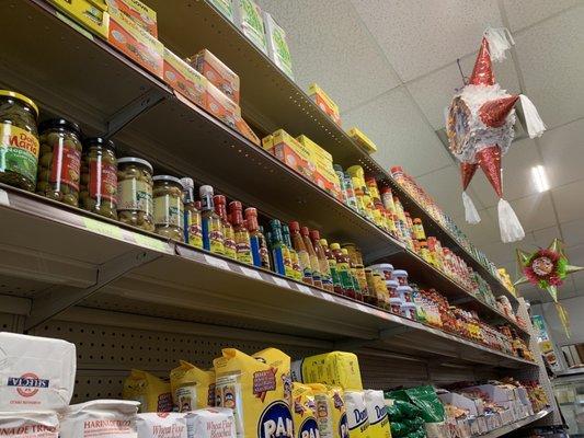 The second shelf down is full of hot sauces