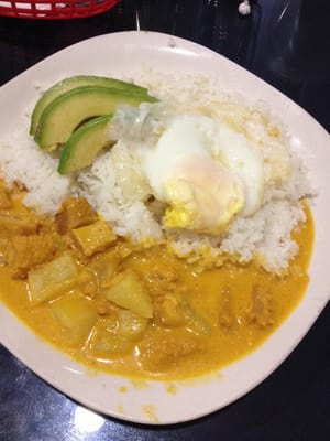 Guatita. Tripe and potatoes in a peanut sauce with avocado, fried egg and white rice.