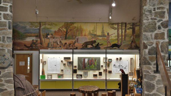 One of our many hand-painted indoor murals, and the big art display case, with changing displays every month.