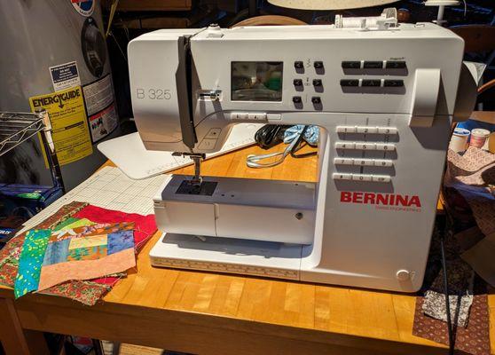 "Our" new Bernina which is hard at work piecing together quilts.