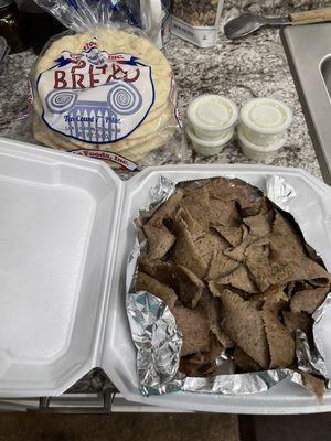 Pound of gyro meat, pita bread and sauce