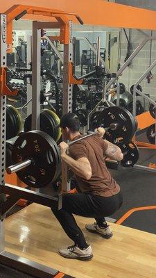 Learn the set-up for the barbell back squat, a staple in many strength and conditioning routines.