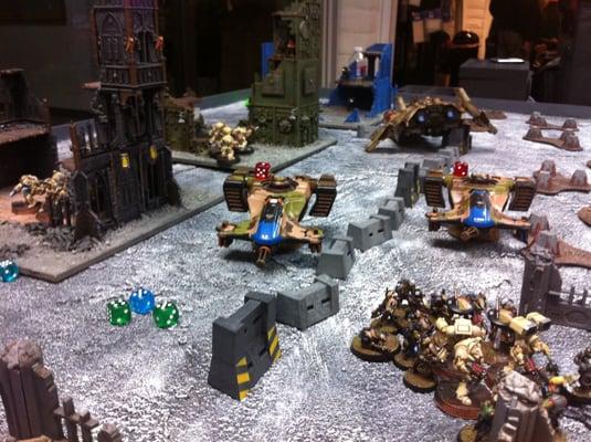 A game of 40k in Mythic's spacious game room.