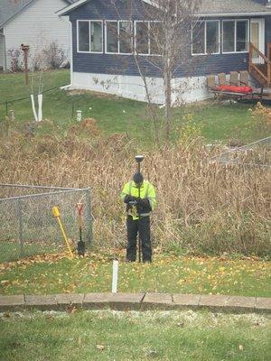 Ryan working on surveying our property.