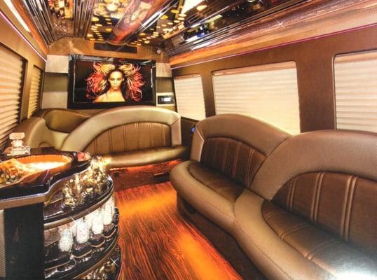 Inside one of our Mercedes Limo Buses. Seats up to 12. Ride in luxury with a fully loaded entertainment system you control.