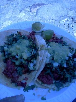 Two delicious  carne enchilada tacos