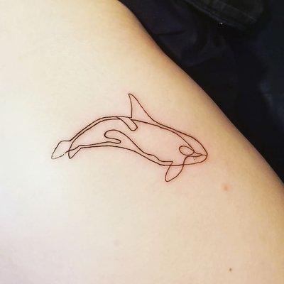 Fine line orca tattoo.