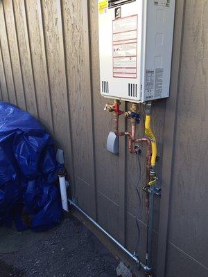 Installation of gas line and tankless water heater.