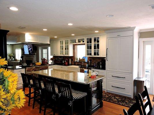 (1 of 3) Kitchen with Island. Sub Zero Refrigerator panels. Custom Hood.