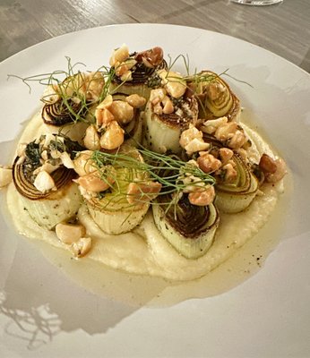 Leeks over parsnip puree with macrona almond and fennel fronds