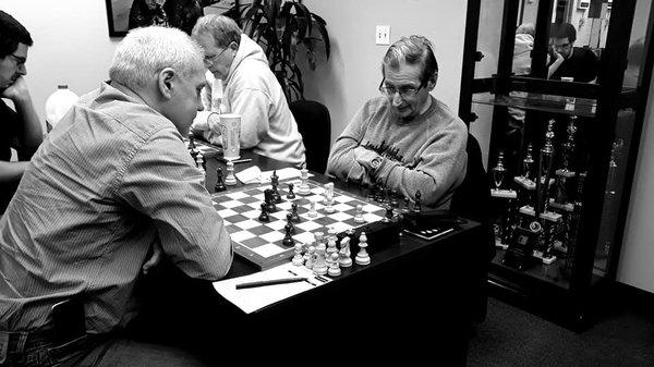 National master Vadim Kudryavtsev (left) plays the venerable expert James Mennella on one of the top boards.