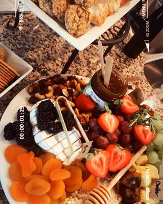 Charcuterie board, gluten free pastries & fruit.