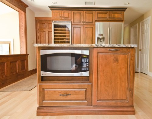 This Haverhill kitchen with wine rack was custom built by Paul's Carpentry Workshop