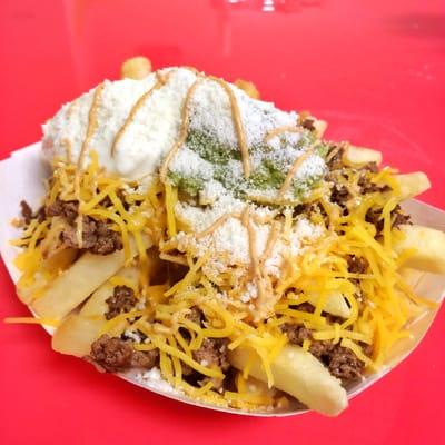 Carne asada fries! Jalapeño lime marinated sirloin steak,cheese, sour cream, guacamole, and queso cotija on top of french fries!