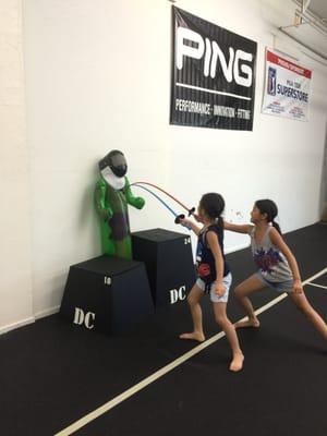 Our fencing kids practicing their lunge on the Hulk!