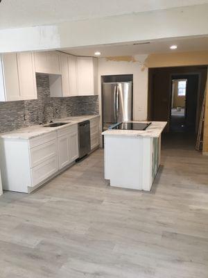 Full kitchen remodel: installment of Custom cabinetry, Vinyl planks flooring and appliances