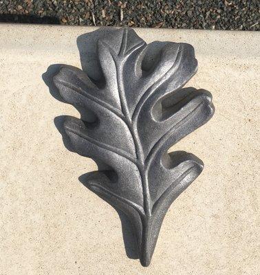 A metal element on a concrete seat.