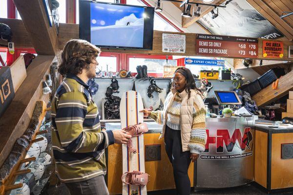 A customer renting a snowboard