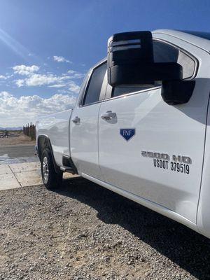 Before and after the road polish, an American work truck