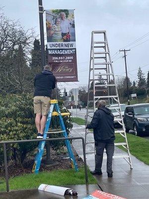 New boulevard signs made by FastSigns going up on our lamp posts in front of the community.