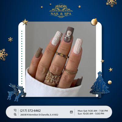 Embrace the festive spirit with whimsical brown nails featuring adorable Christmas reindeer, adding a touch of holiday charm to your Xmas lo