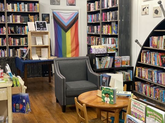 A partial view of our children's book area, as well as our young adult area and fantasy book shelves.