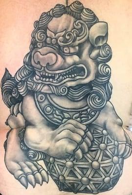 This very well done foo dog was done by Eric Carlson at wild zero. I couldn't be happier with the work he has done on me over the years.