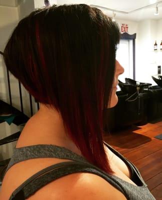 Asymmetrical haircut and red color.