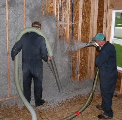 Blowing Cellulose Insulation and vacuuming the excess for re-use. Recycling a recycled insulation!