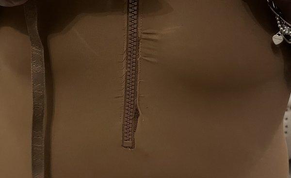 What the zipper looks like when the bathing suit is on.