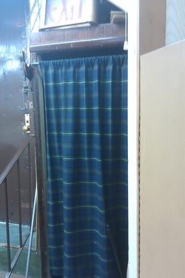 This is one of the fitting rooms, behind the curtain