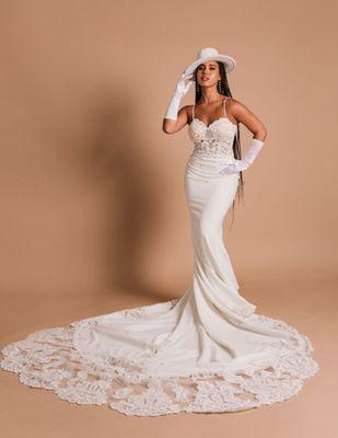 Want to make a fashion statement on your wedding day? This gown has a stretchy and comfortable bottom with hand beaded and lace design.