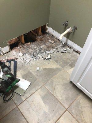 the damage even spread through to the laundry room on the other side of the wall, yet indicated ZERO damage until tile removal.