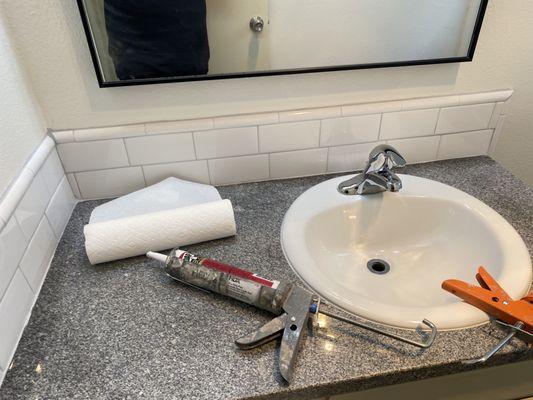 Tile, sink and granite countertop