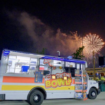 Acme Chicken Truck at Night with fireworks