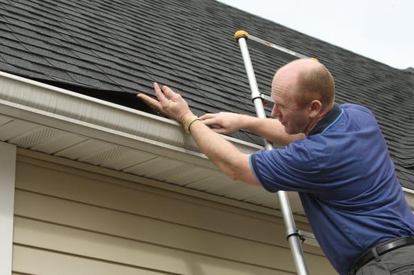 Chris checking number of roof layers