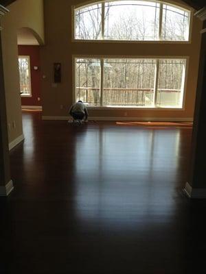 Robert is putting the finishing touches on this Brazilian Cherry hardwood with Sedona Red stain color